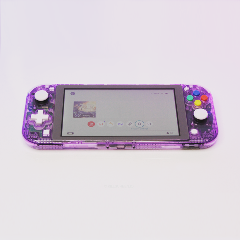Atomic Purple Nintendo Switch Lite laying down