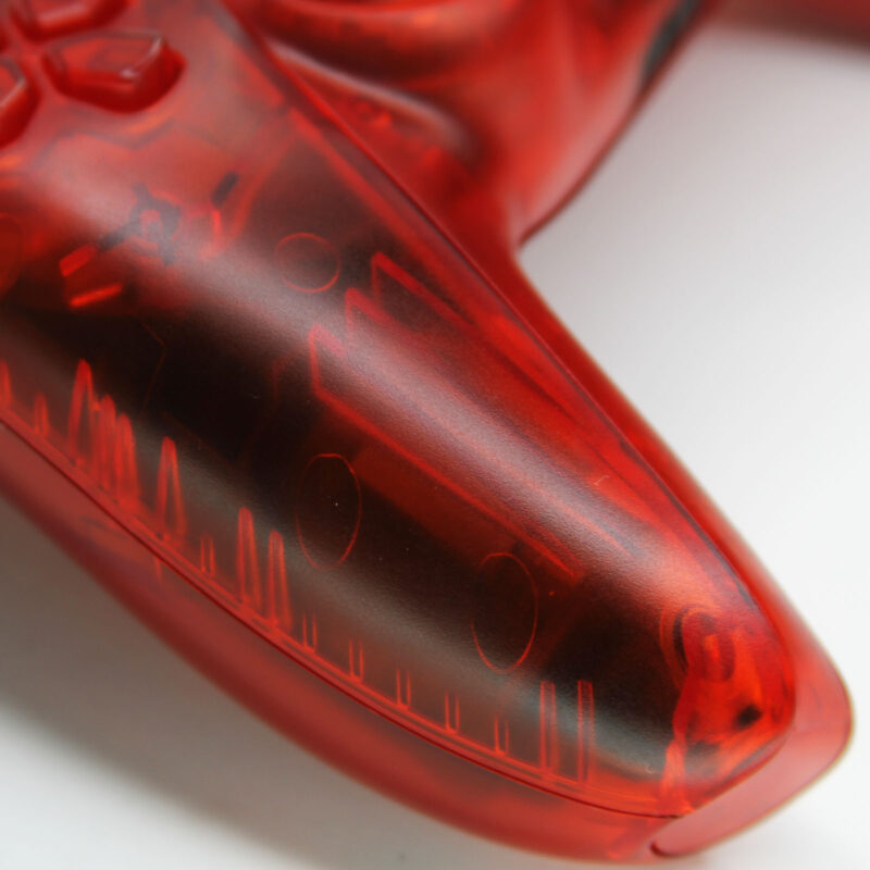 Close-up of Killscreens Triple Clear Red PS5 Controller