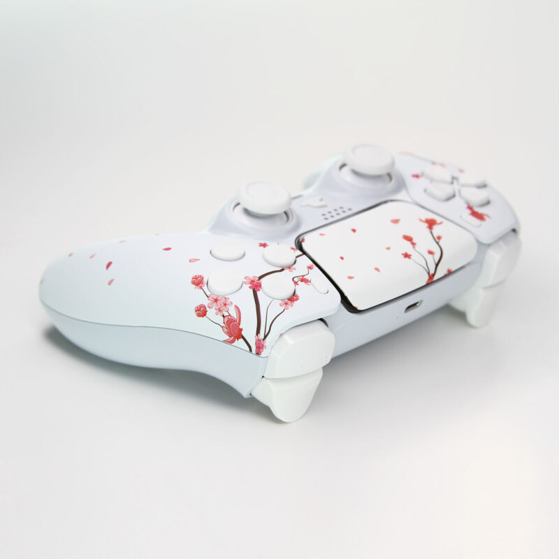 Left back side of Killscreen's White Cherry Blossoms PlayStation 5 Wireless Controller