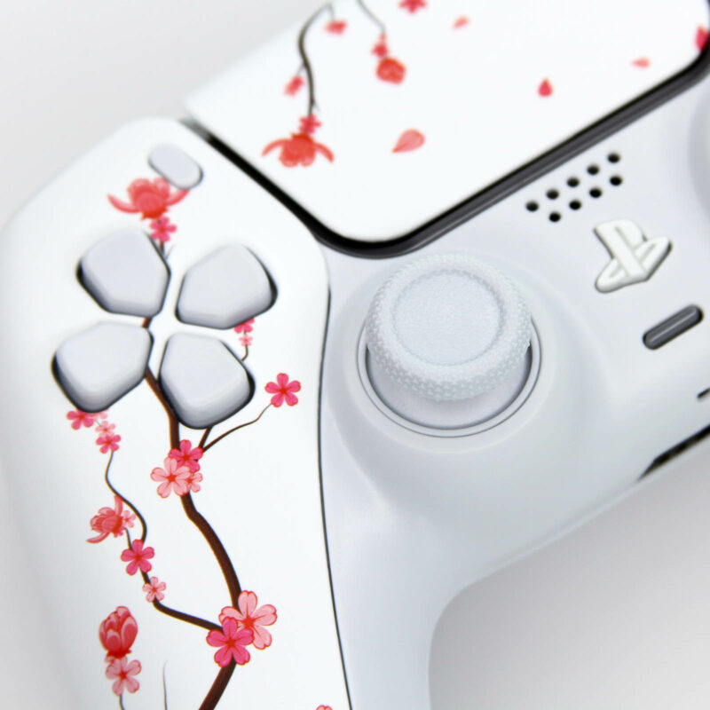 Close up of dpad on Sakura cherry blossom ps5 controller