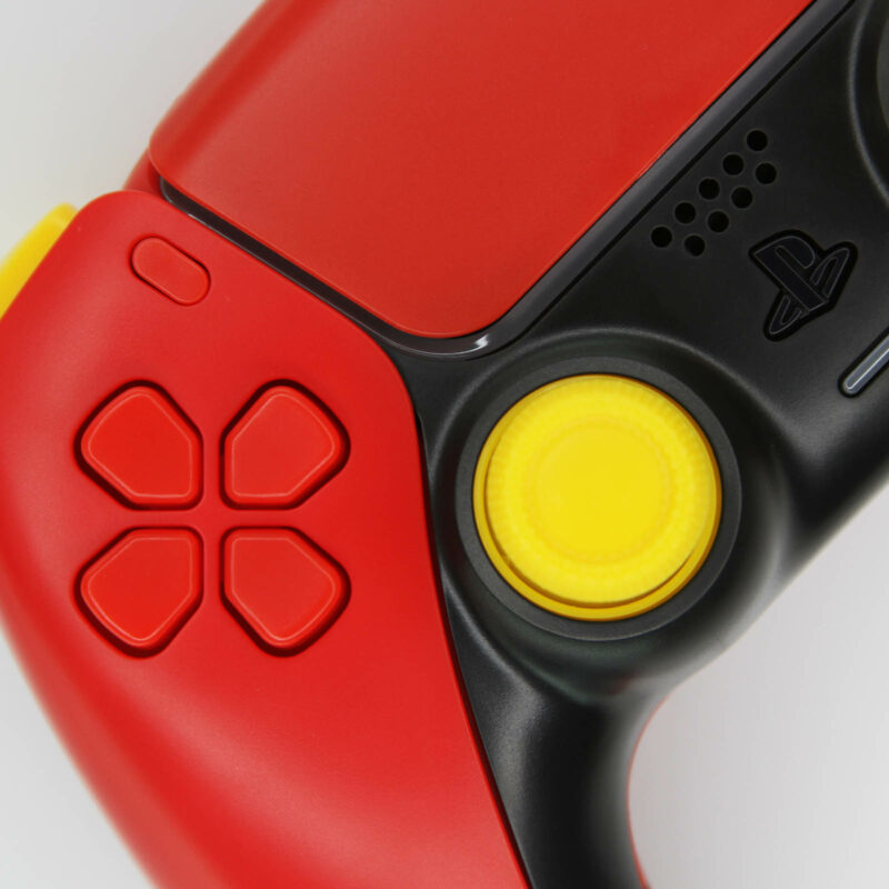 Close-up of top left of Red Street Fighter Ken PS5 Controller by killscreen.io