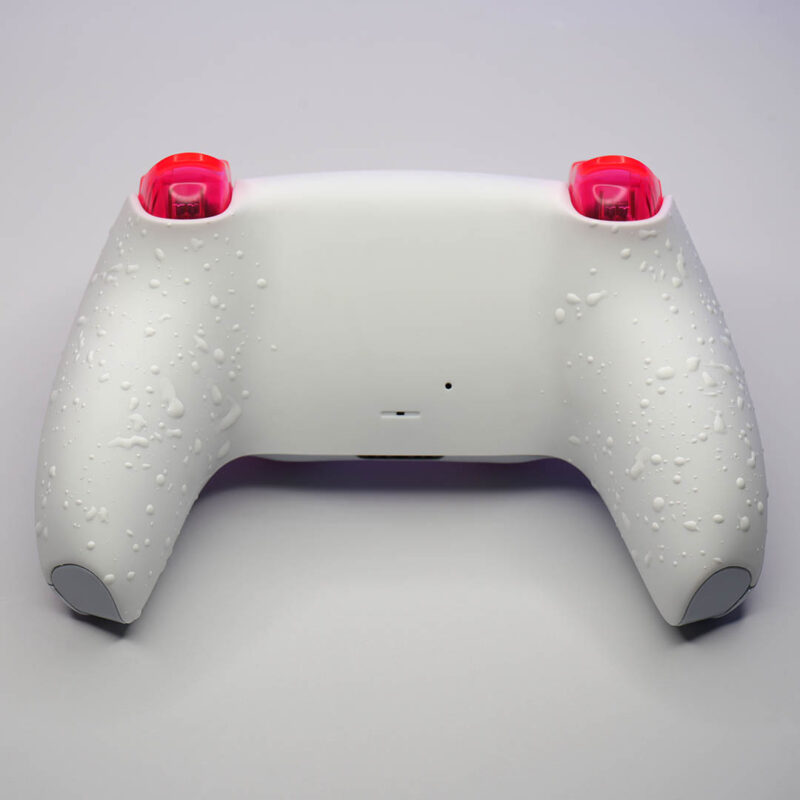 White splatter grip on Sakura Neon PS5 Controller