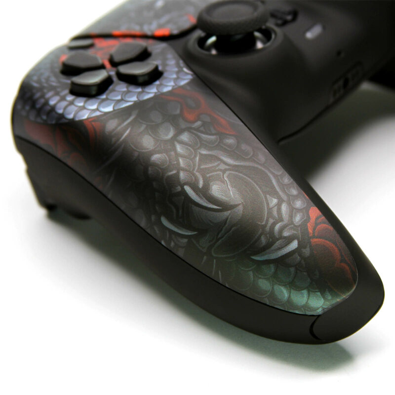 Left arm of Red Lotus Dragon PS5 Controller showing dragon holding sphere representing Earth