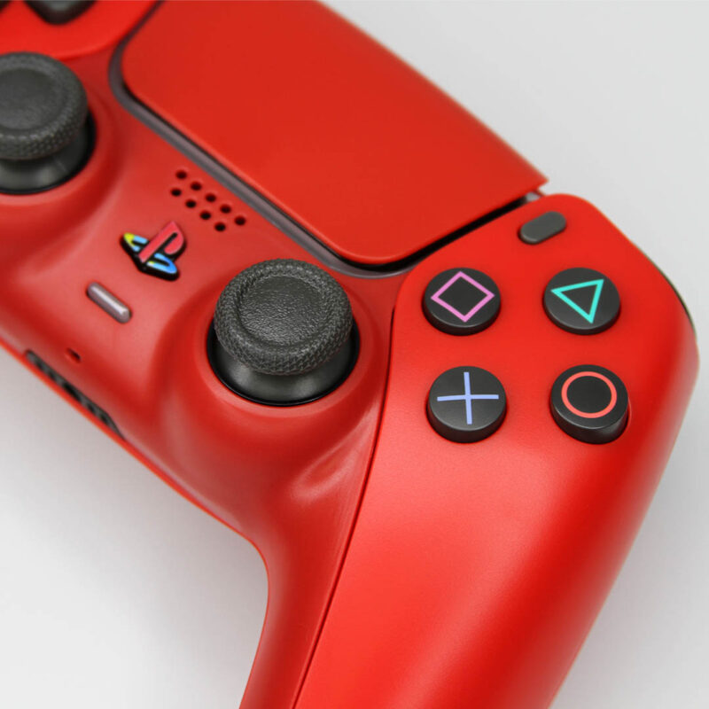 Close up of shape buttons on Cinnabar Red Retro PS5 Controller by Killscreen