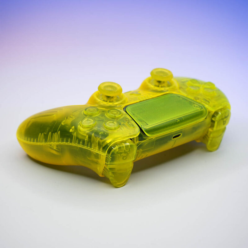 Action buttons, bumpers, and triggers on clear lemon yellow PS5 controller