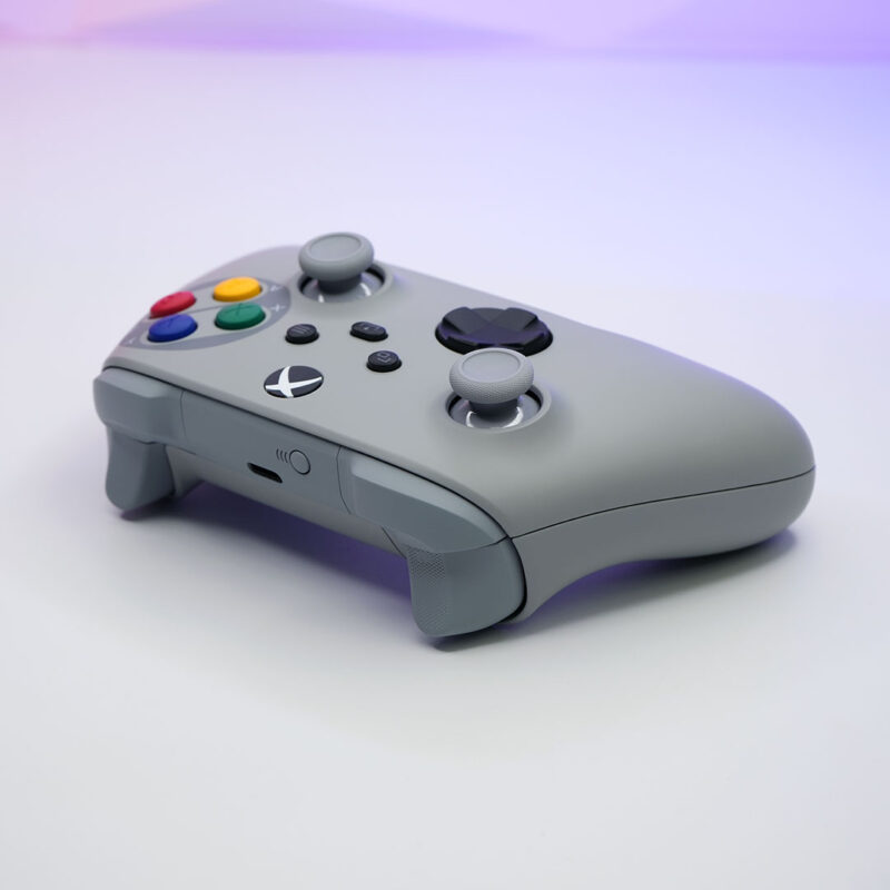 Custom SNES-inspired Xbox Series X|S controller shown from a raised angle, highlighting the signature Super Famicom button colors.