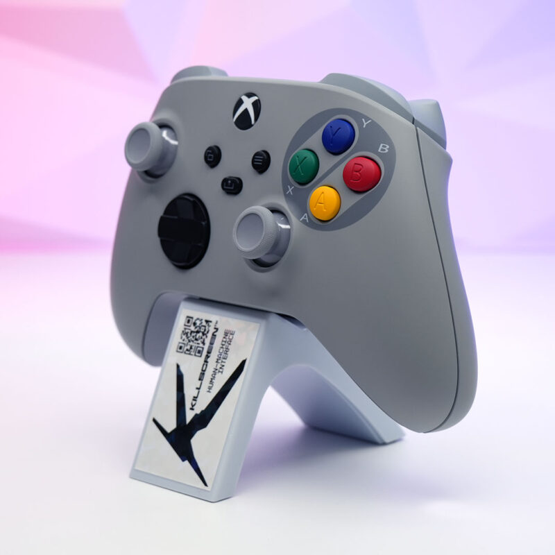 Custom SNES-inspired Xbox Series X|S controller propped up with a Killscreen-branded card, featuring Super Famicom-style buttons.